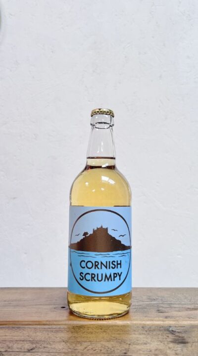 A bottle of Polgoon Cornish scrumpy cider. Image of St Michael's Mount that is 10 minutes away from Polgoon.